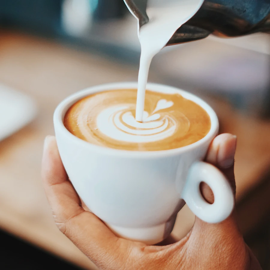 Latte art being poured
