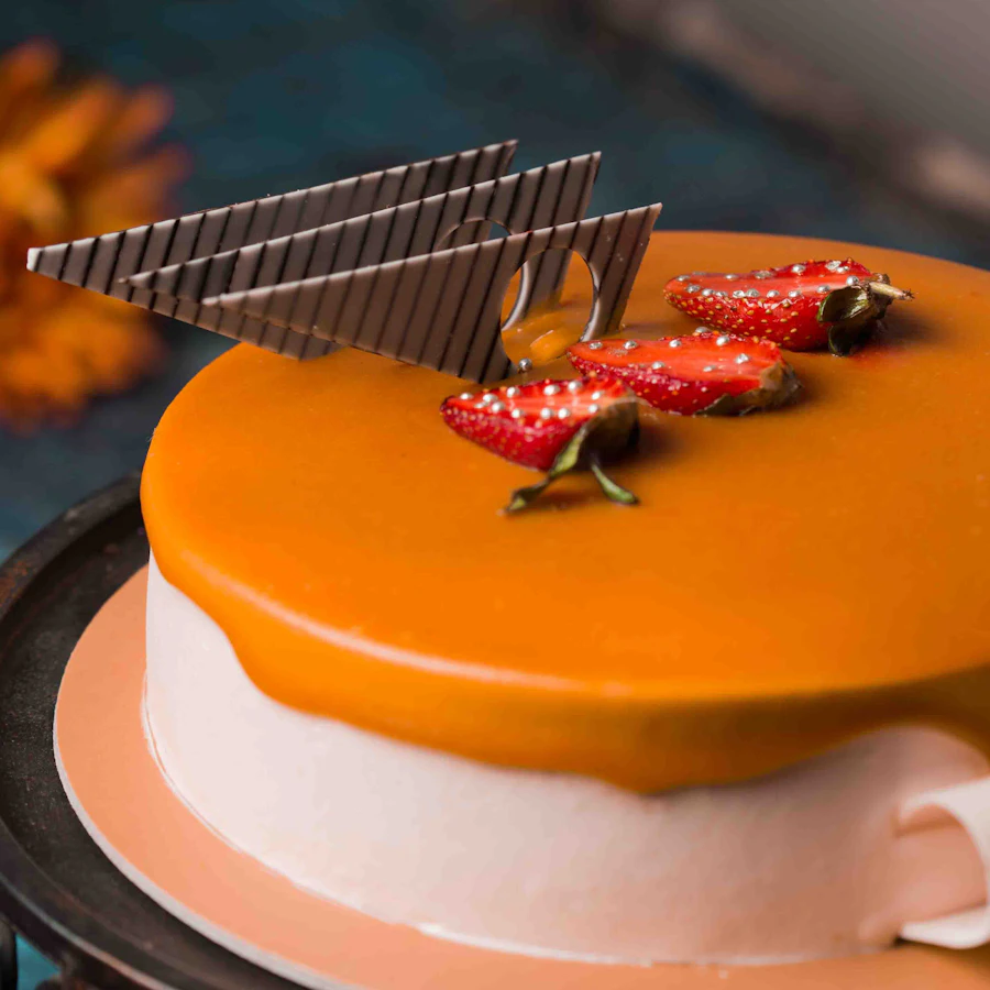 A celebration cake with fruit on top